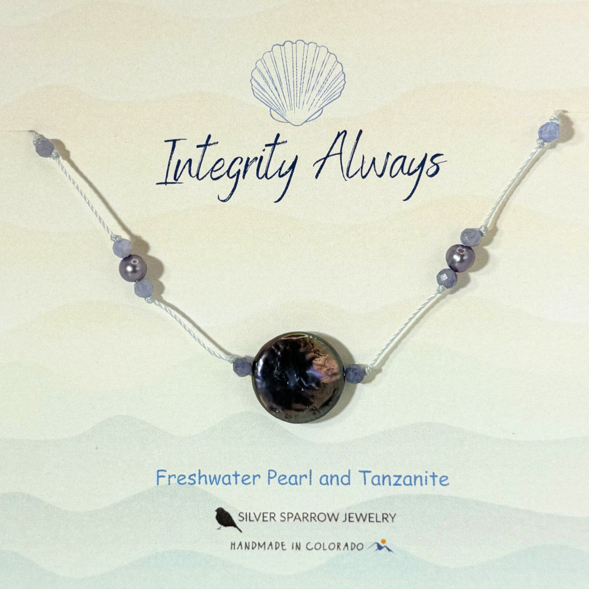 Freshwater peacock coin pearl with tanzanite