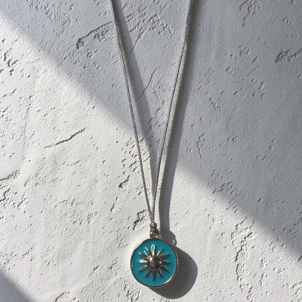 Neon enamel blue sun necklace